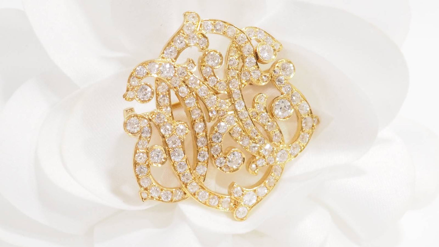 Broche volutes Art Nouveau en or jaune et diamants