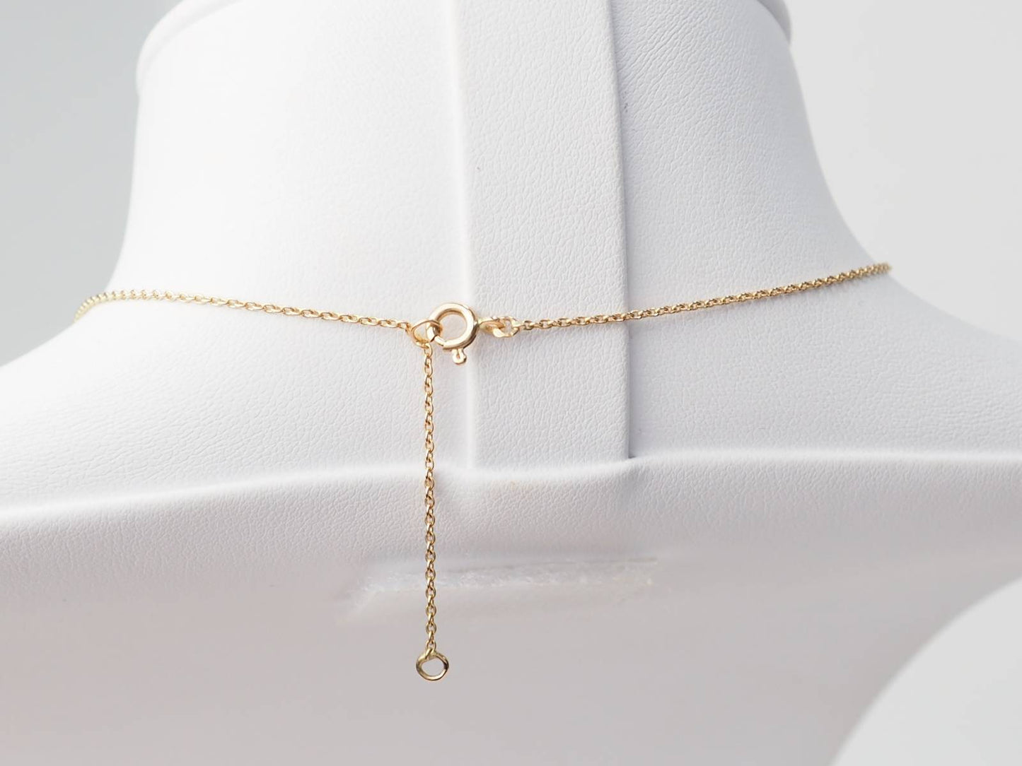 Collier volutes en or jaune et argent, grenat diamants et perle