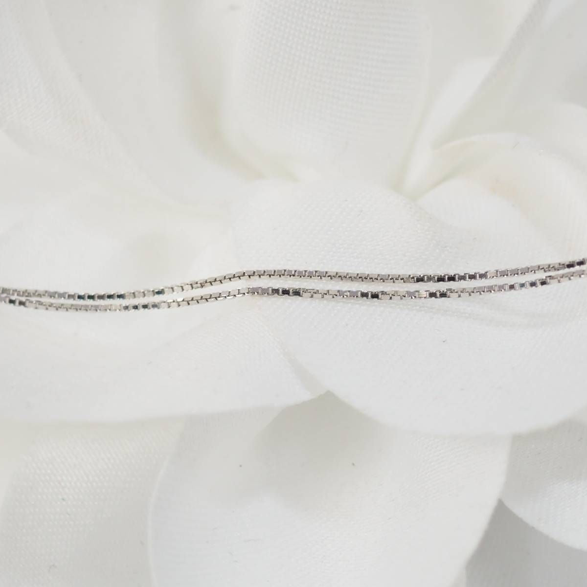 Collier 4 cœurs imbriqués en or blanc 750 et diamants