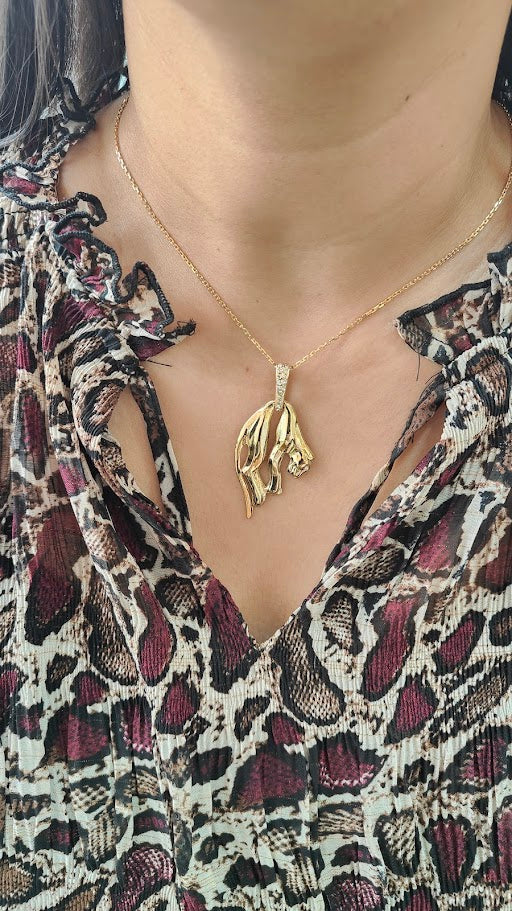Pendentif panthère en or jaune et diamants
