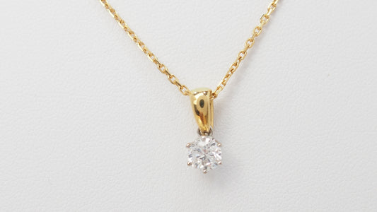 Collier solitaire en or bicolore et diamant