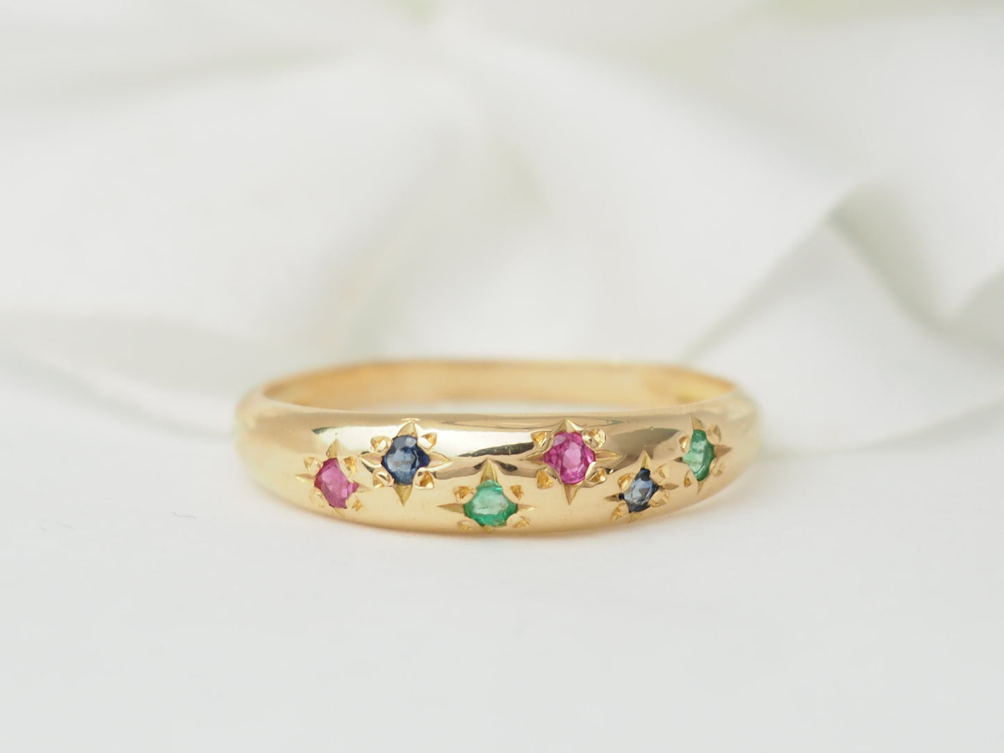 Bague jonc en or rose et pierres précieuses