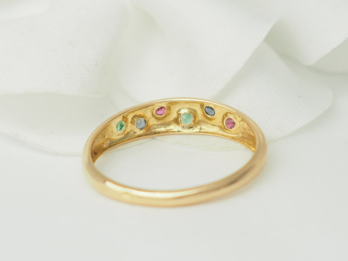 Bague jonc en or rose et pierres précieuses