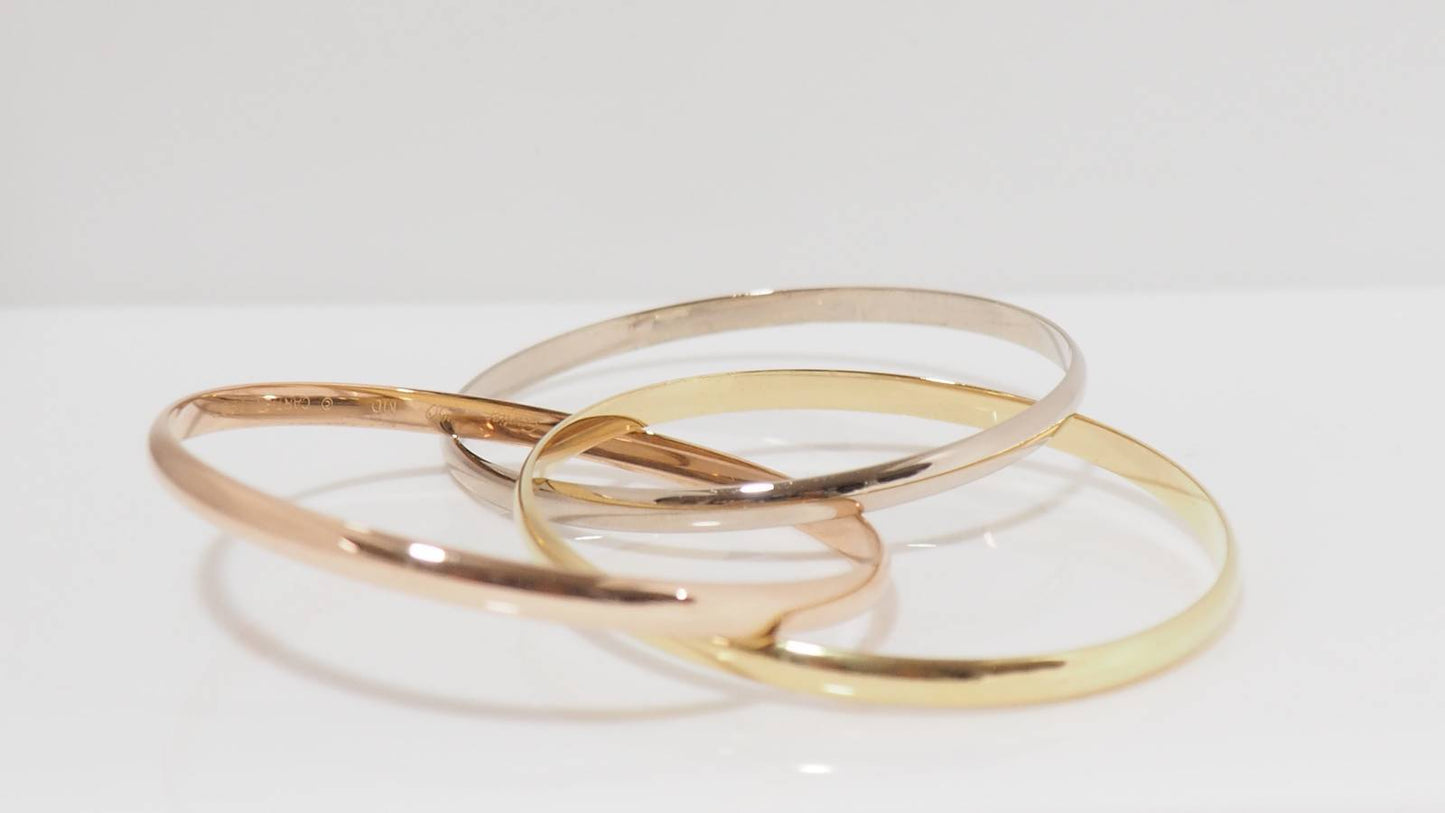 Bracelet Trinity de Cartier d'occasion trois ors