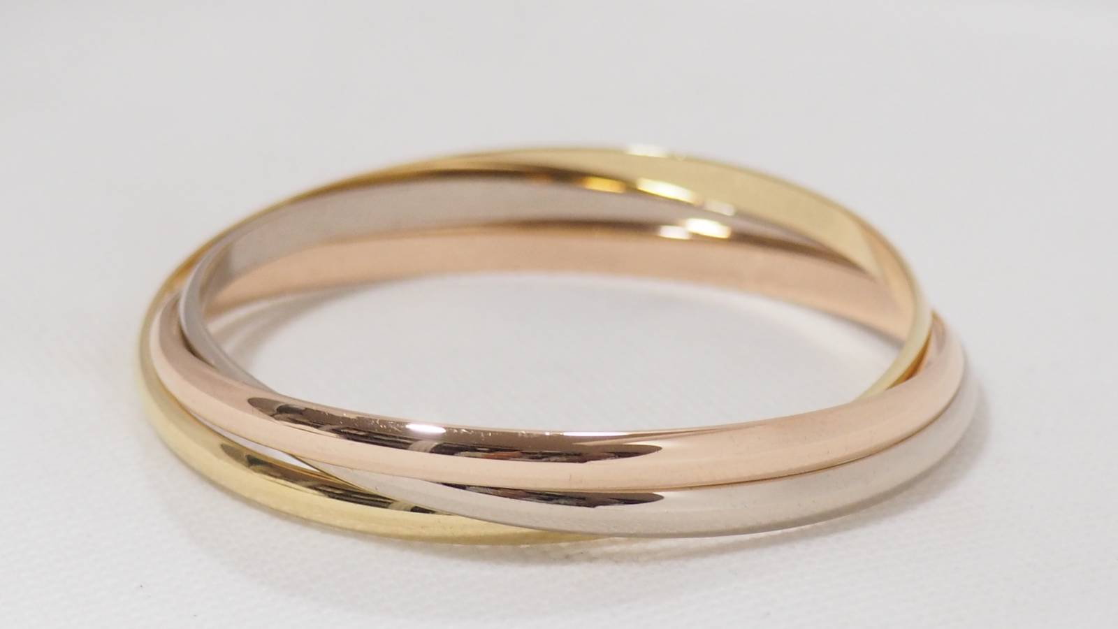 Bracelet Trinity de Cartier d'occasion trois ors