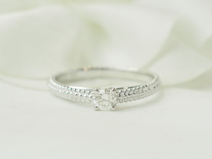 Bague solitaire Mauboussin "Fan du premier jour" en or blanc et diamant