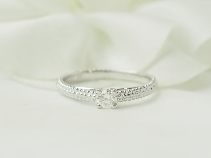 Bague solitaire Mauboussin "Fan du premier jour" en or blanc et diamant