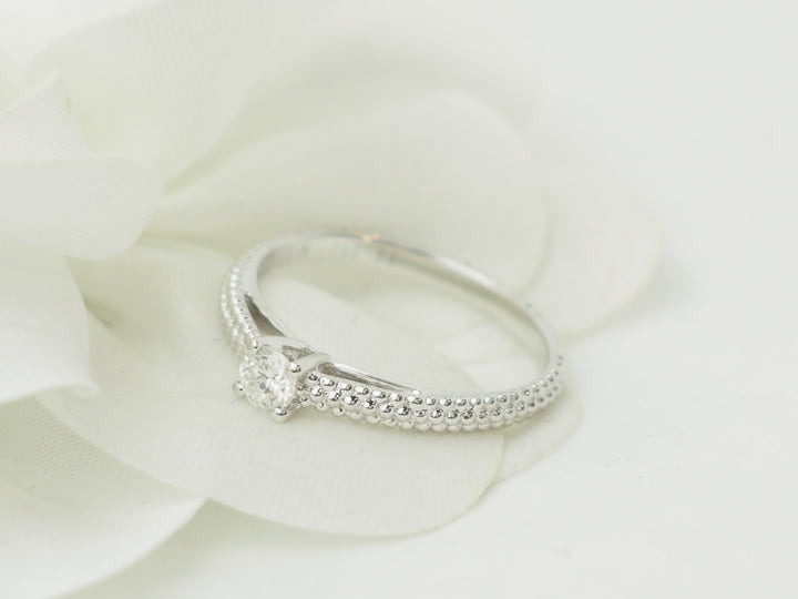 Bague solitaire Mauboussin "Fan du premier jour" en or blanc et diamant