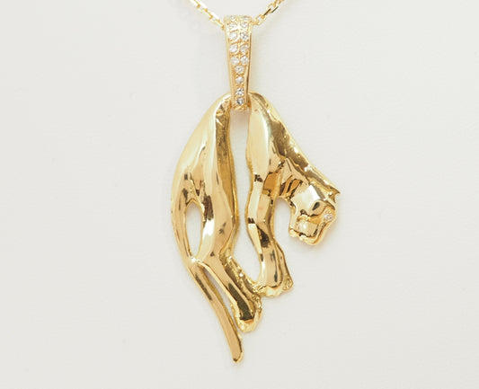 Pendentif panthère en or jaune et diamants