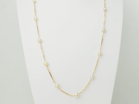 Collier en or jaune à perles de culture alternées par des barres