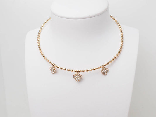 Collier boules à motif fleurs en or rose 