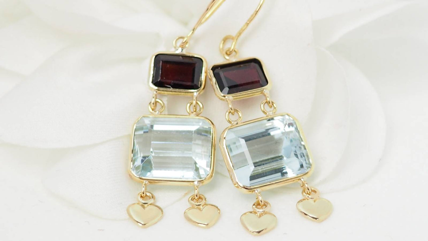 Boucles d'oreilles en or jaune, aigue marine et grenat