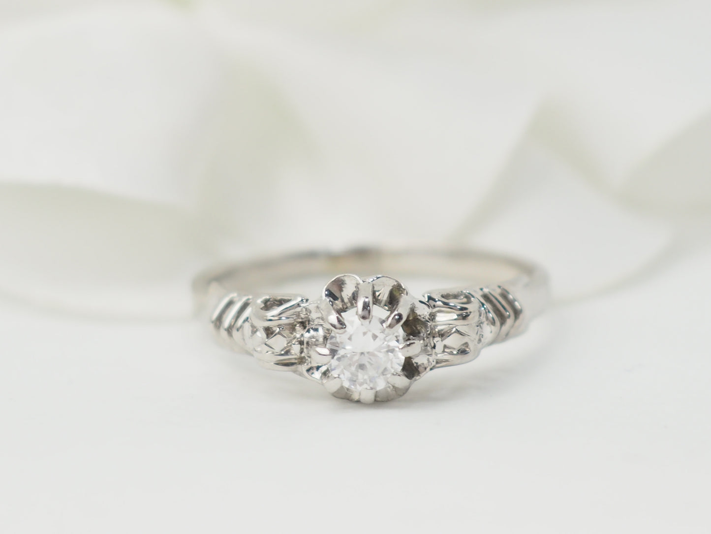 Bague solitaire en or blanc et platine, diamant 0,23ct