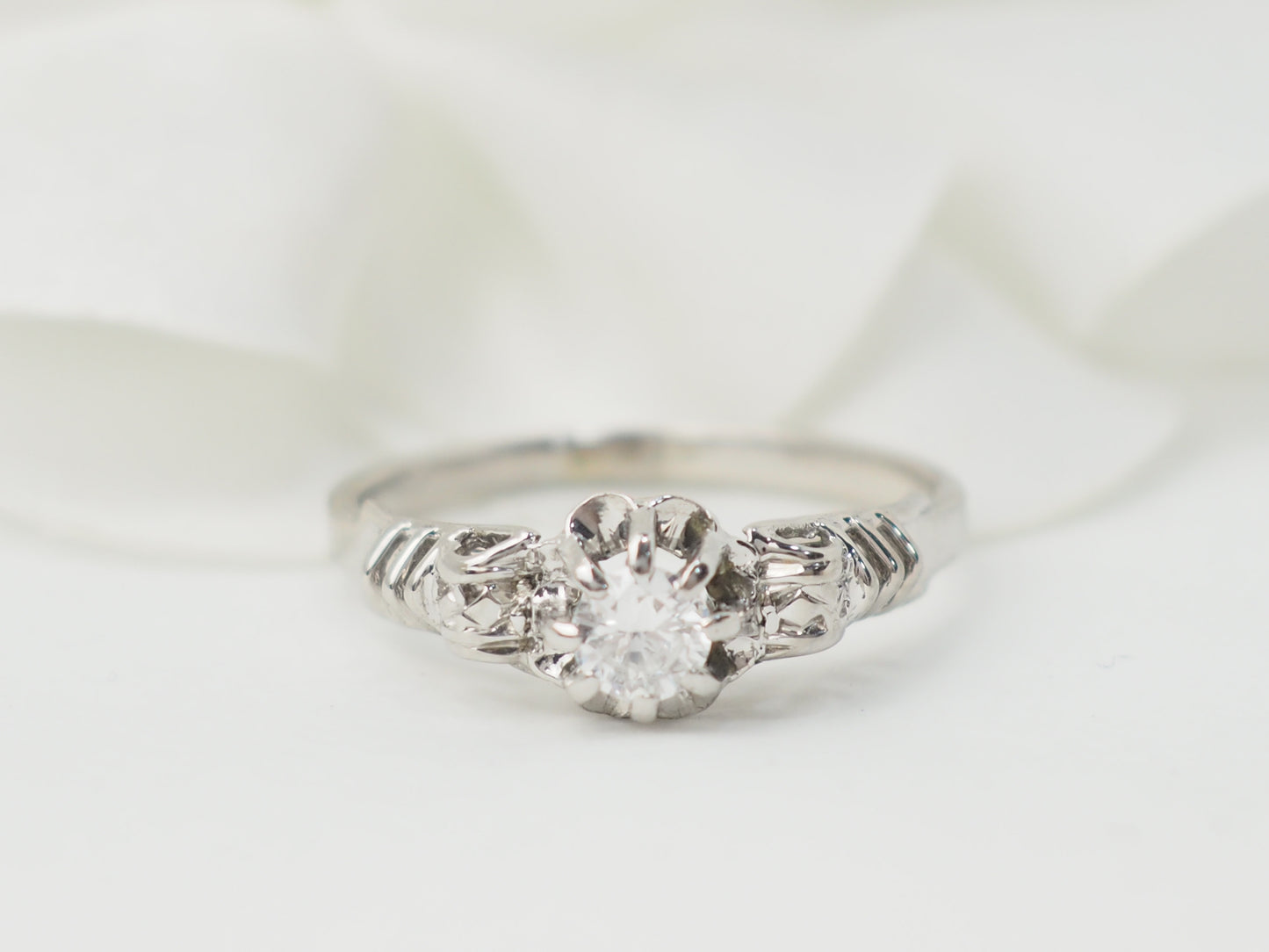 Bague solitaire en or blanc et platine, diamant 0,23ct