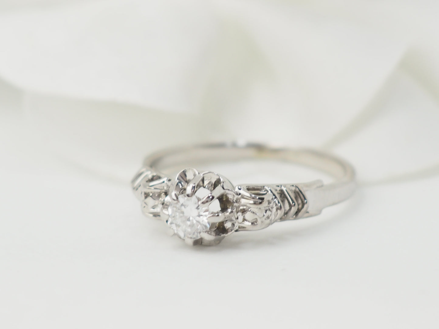 Bague solitaire en or blanc et platine, diamant 0,23ct