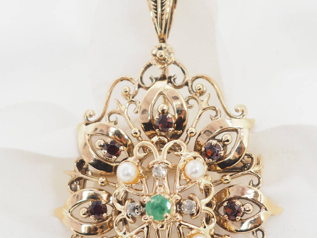 Broche pendentif en or jaune, emeraude et perles de culture