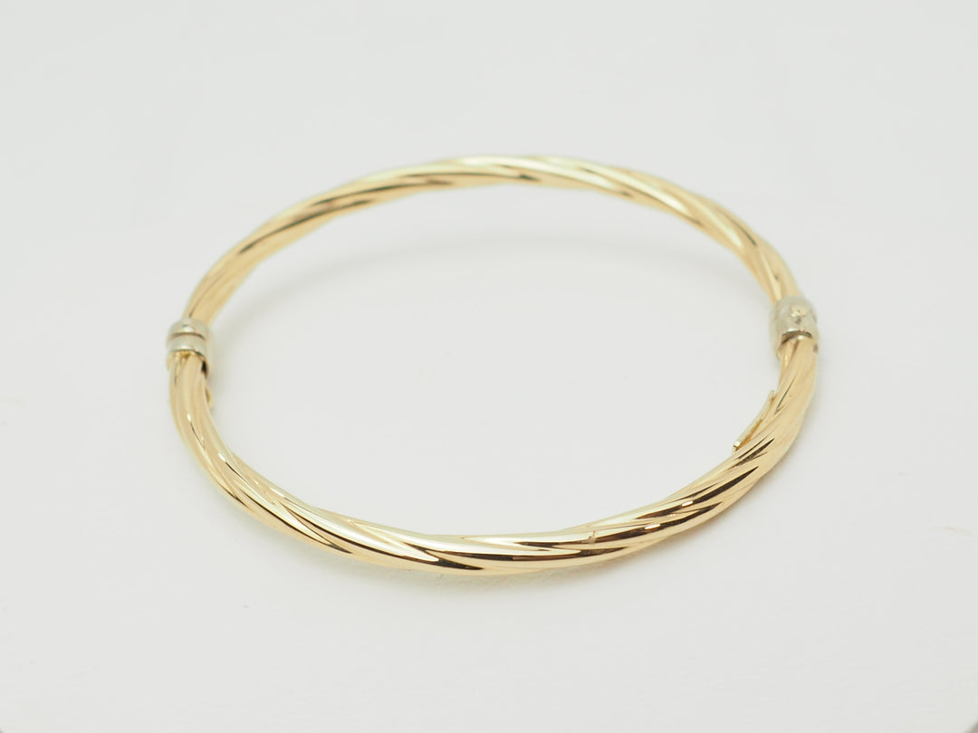 Bracelet ouvrant enfant en or jaune – Jonc torsadé