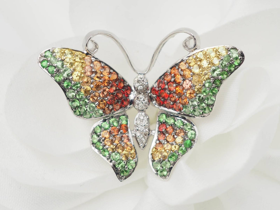 Broche papillon en or blanc, citrine, topaze et péridot
