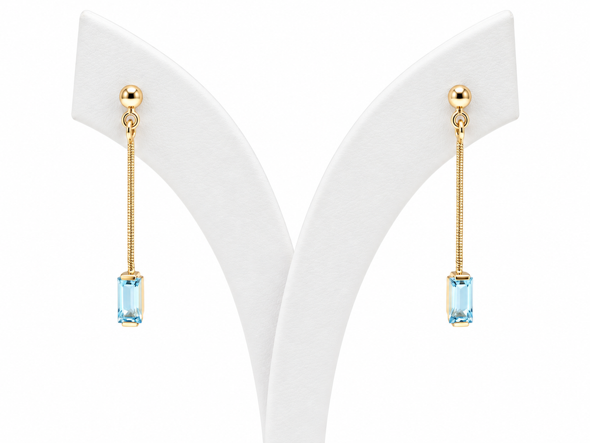 Boucles d’oreilles pendantes en or jaune 18 carats serties de topazes bleues rectangulaires