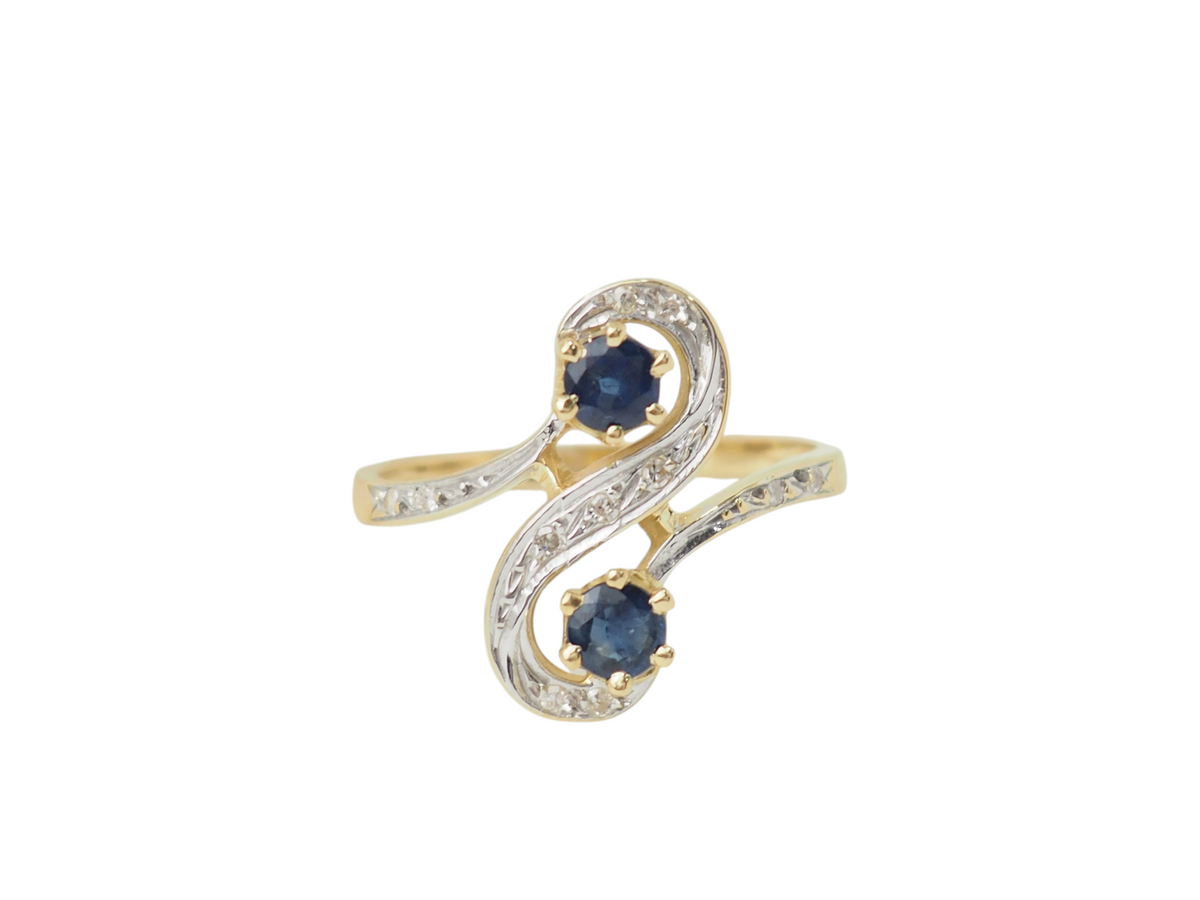 Bague Toi et Moi L'Aurore en or bicolore 18k, sertie de deux saphirs ronds et de diamants étincelants