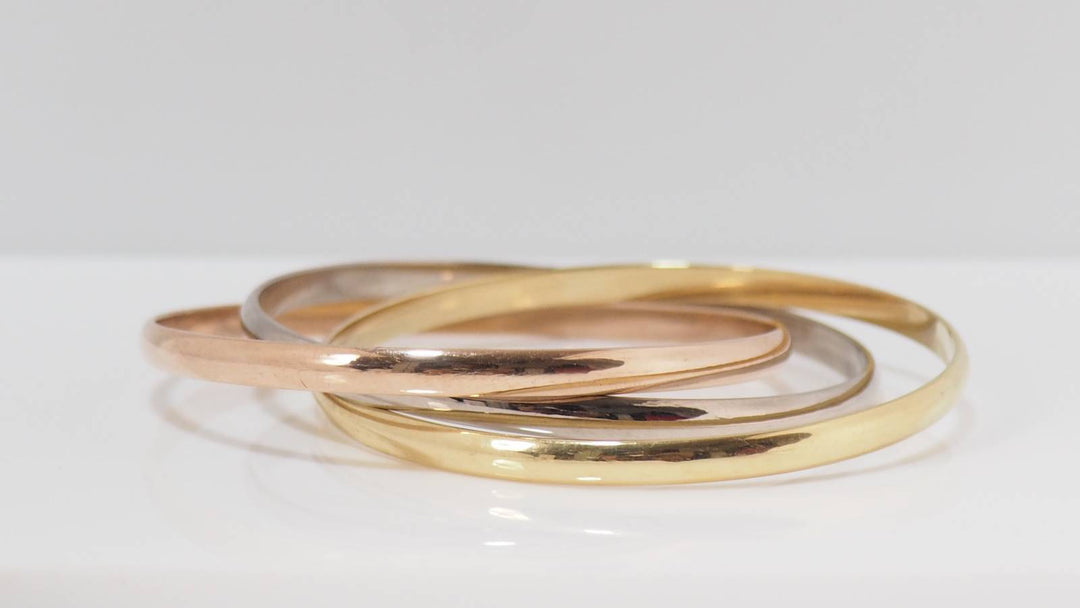 Bracelet Cartier Trinity demi-jonc vintage en or jaune, rose et blanc 18 carats chez L&