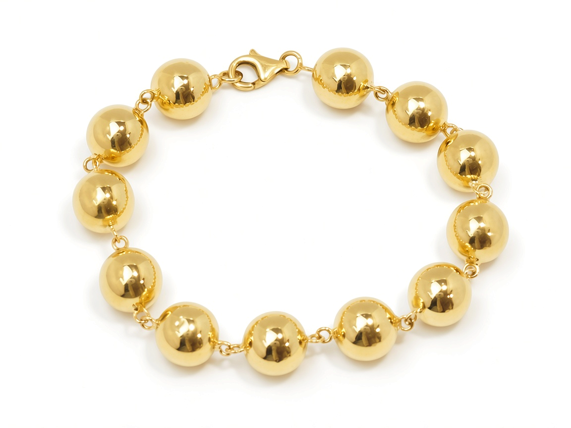 Bracelet marseillais L'Aurore en or jaune 18 carats composé de boules polies de 12 mm avec fermoir mousqueton