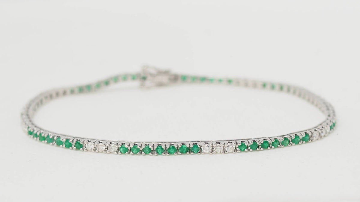 Bracelet rivière L'Aurore en or blanc 18 carats serti d'émeraudes et de diamants taille brillant