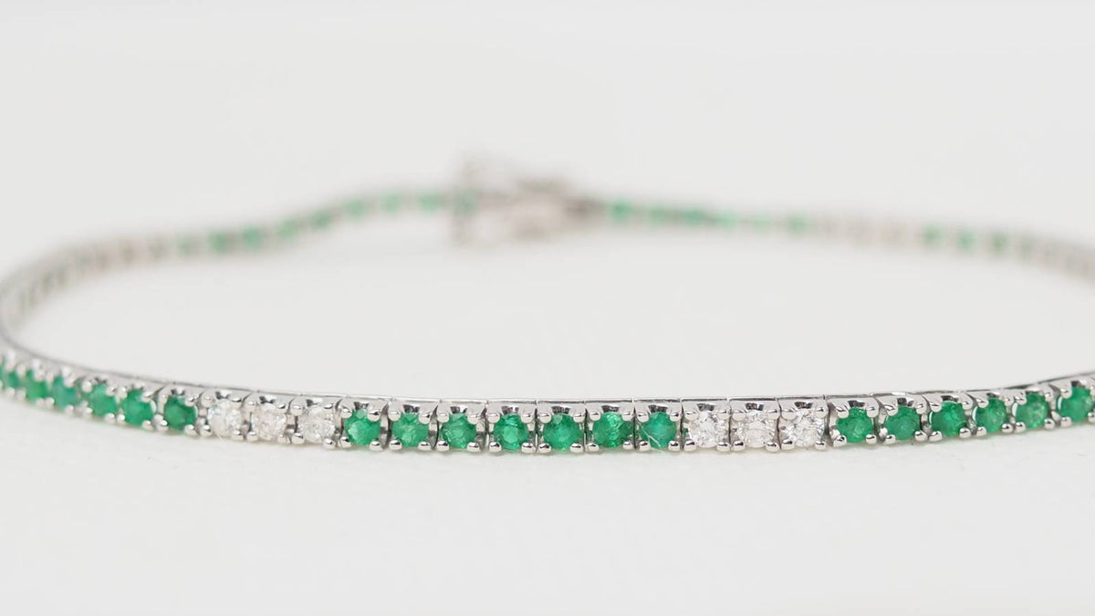 Bracelet rivière L'Aurore en or blanc 18k serti d'émeraudes et de diamants taille brillant