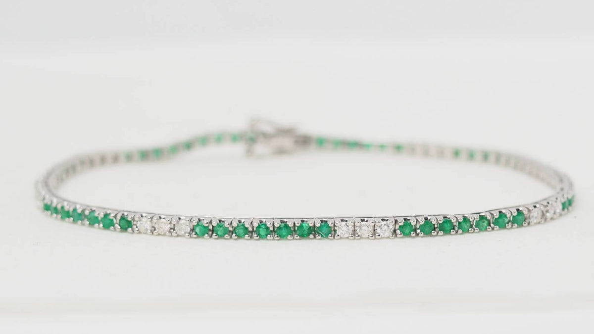 Bracelet rivière L'Aurore en or blanc 18kt serti d'émeraudes et de diamants taille brillant