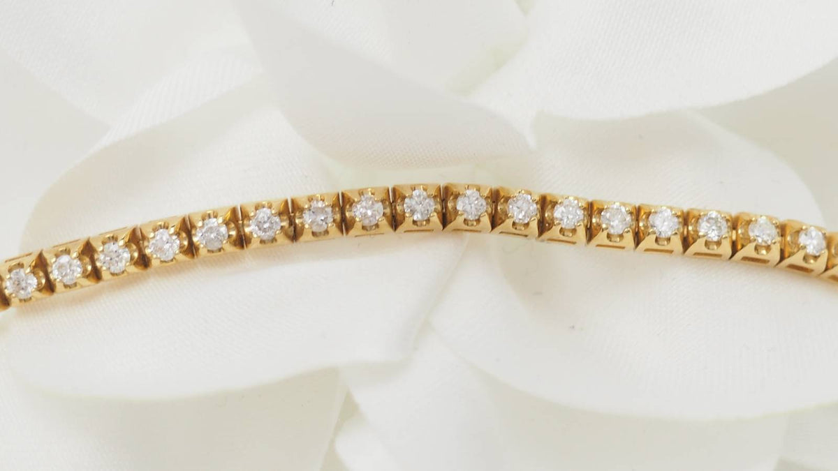 Bracelet rivière L'Aurore en or jaune 18 carats serti de 60 diamants taille brillant totalisant 1,50 carat