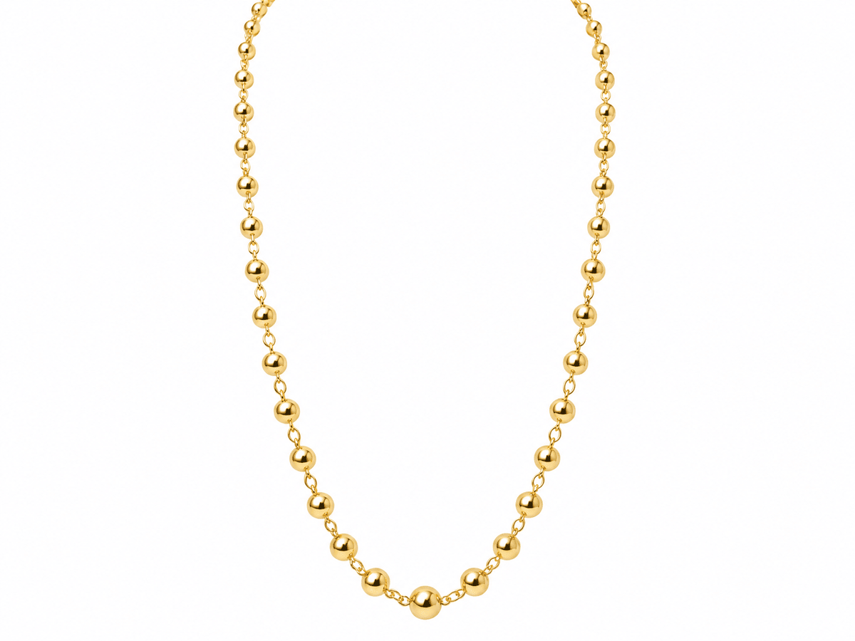 Collier Marseillais L'Aurore en or rose 18 carats composé de boules de diamètres dégressifs, style vintage années 1960.