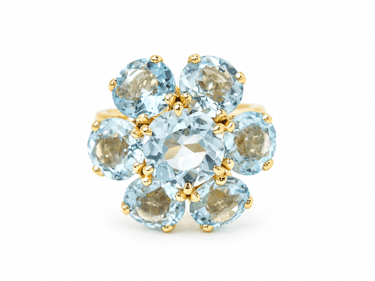 Bague fleur L'Aurore en or jaune 18 carats ornée de sept aigues-marines rondes, style vintage des années 1950.
