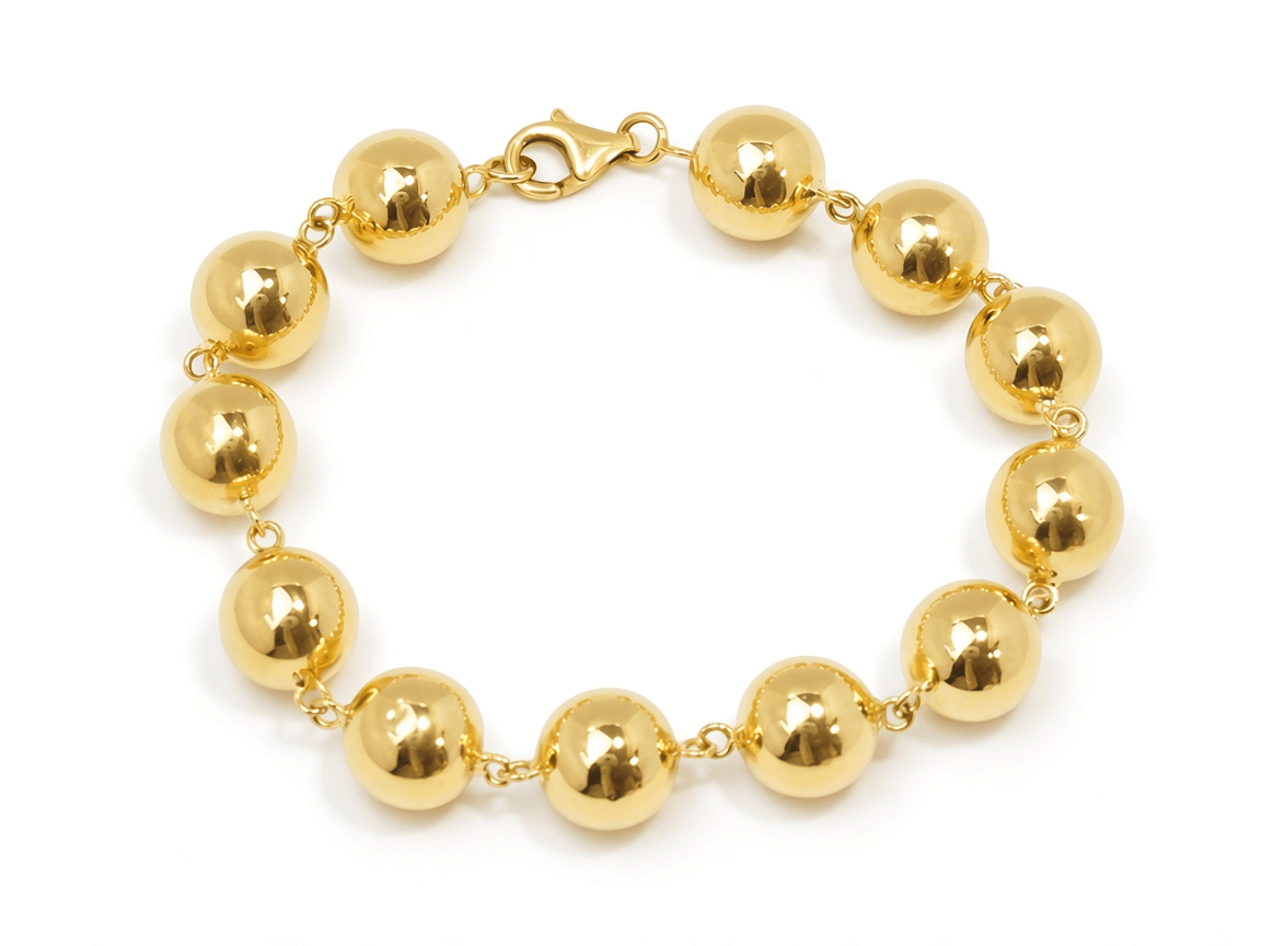 Bracelet marseillais L'Aurore en or jaune 18 carats composé de boules polies de 12 mm avec fermoir mousqueton
