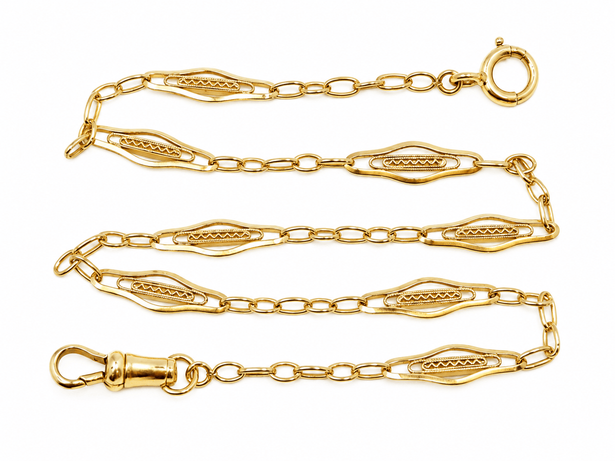 Giletière ancienne Art Nouveau L'Aurore en or jaune 18 carats avec maillons ajourés travaillés de 37 cm