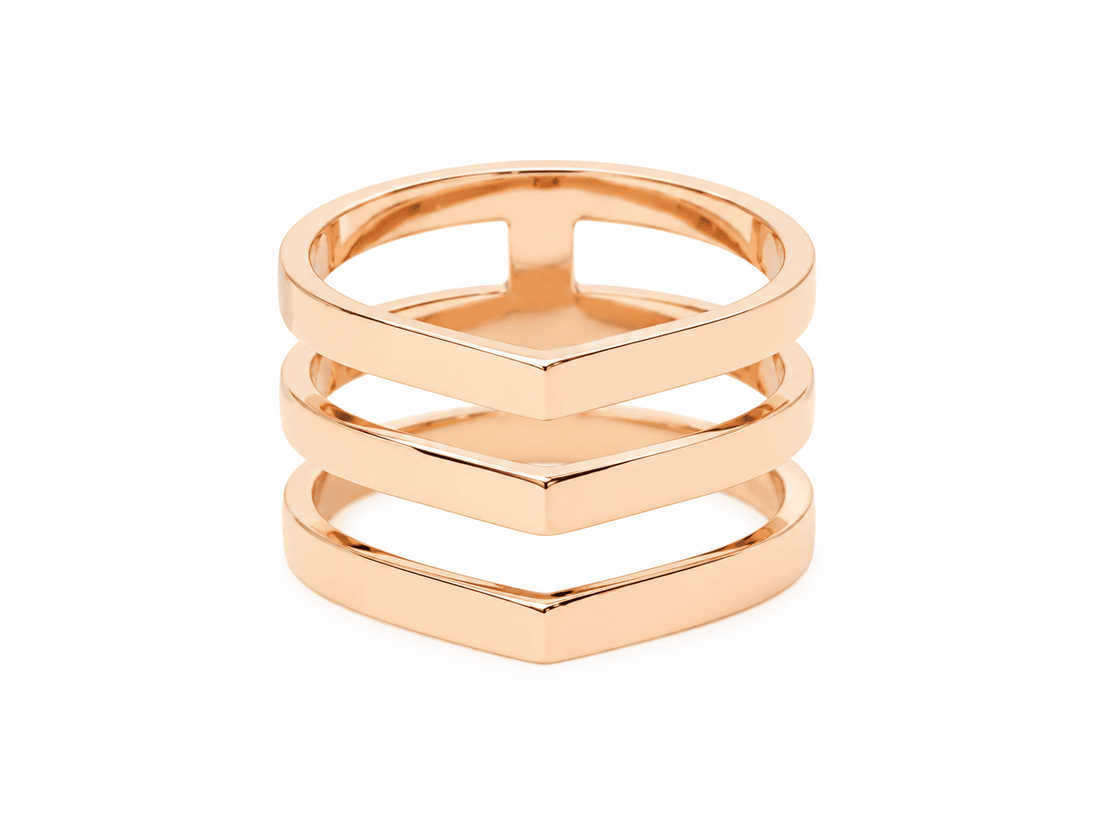 Bague Repossi Antifer multi-rangs en or rose 18 carats, design géométrique en V, disponible chez L'Aurore