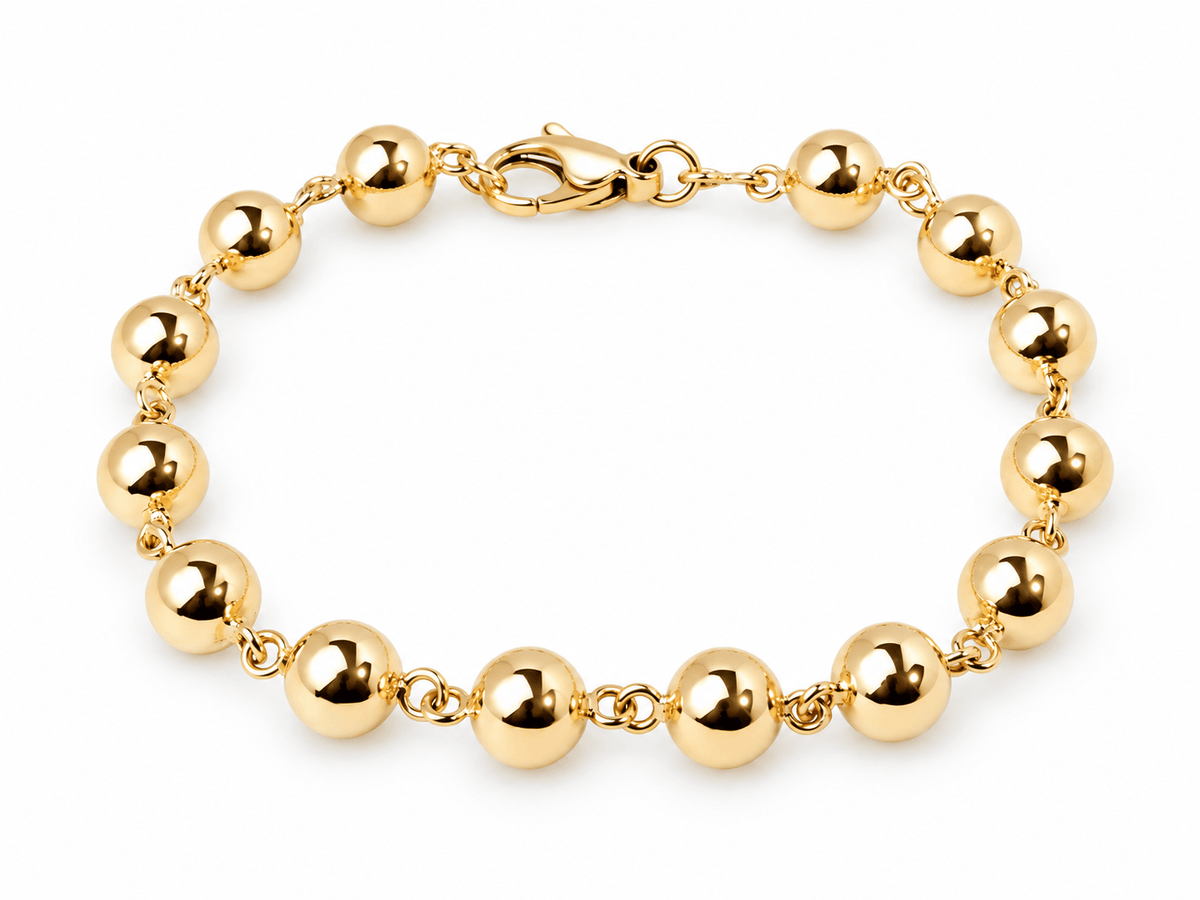 Bracelet marseillais L'Aurore en or rose 18 carats composé de boules régulières de 8 mm avec fermoir mousqueton