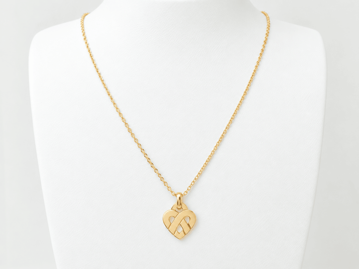 Pendentif Poiray  coeur entrelacé petit modèle en or jaune