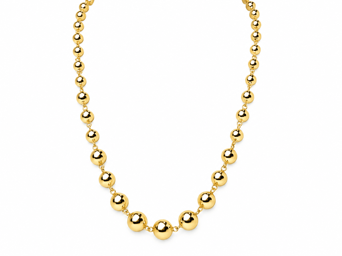 Collier marseillais L'Aurore en or jaune 18 carats composé de boules en chute de 6 à 10 mm de diamètre