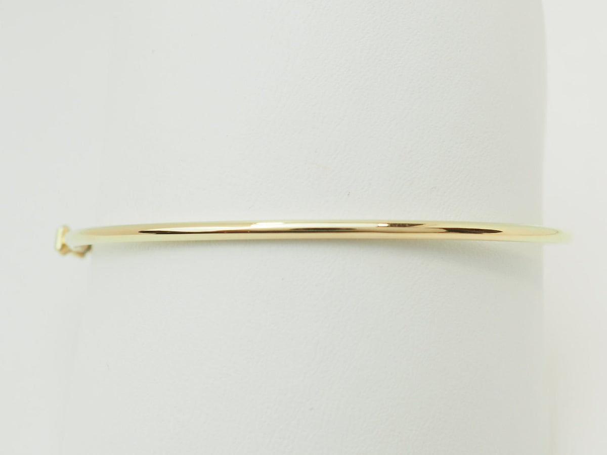 Bracelet jonc flexible L'Aurore en or jaune 18 carats au design épuré et brillant
