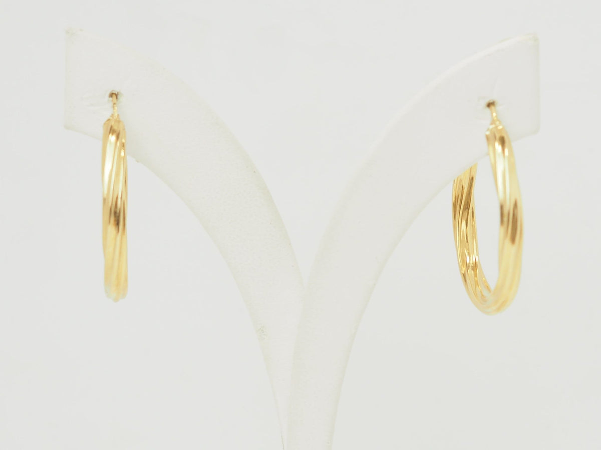 Créoles torsadées L'Aurore en or jaune 18 carats, diamètre 30 mm avec finition polie brillante