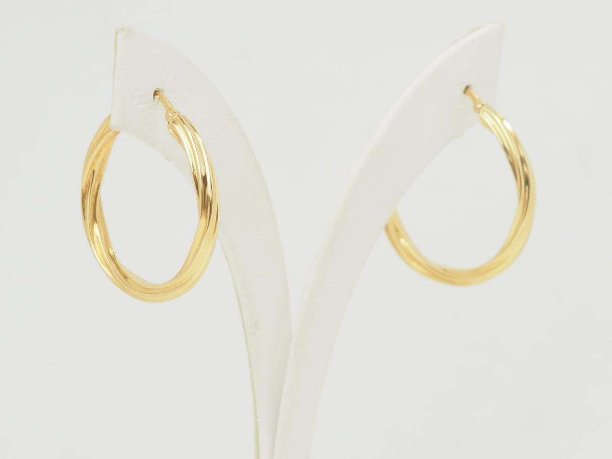 Créoles torsadées L'Aurore en or jaune 18 carats poli, diamètre 30 mm avec fermoir charnière sécurisé