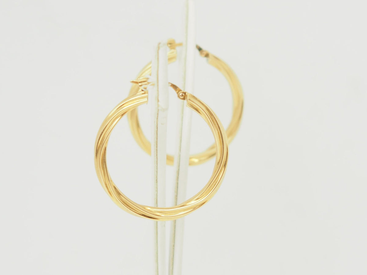 Créoles torsadées L'Aurore en or jaune 18 carats, diamètre 30 mm avec finition polie brillante
