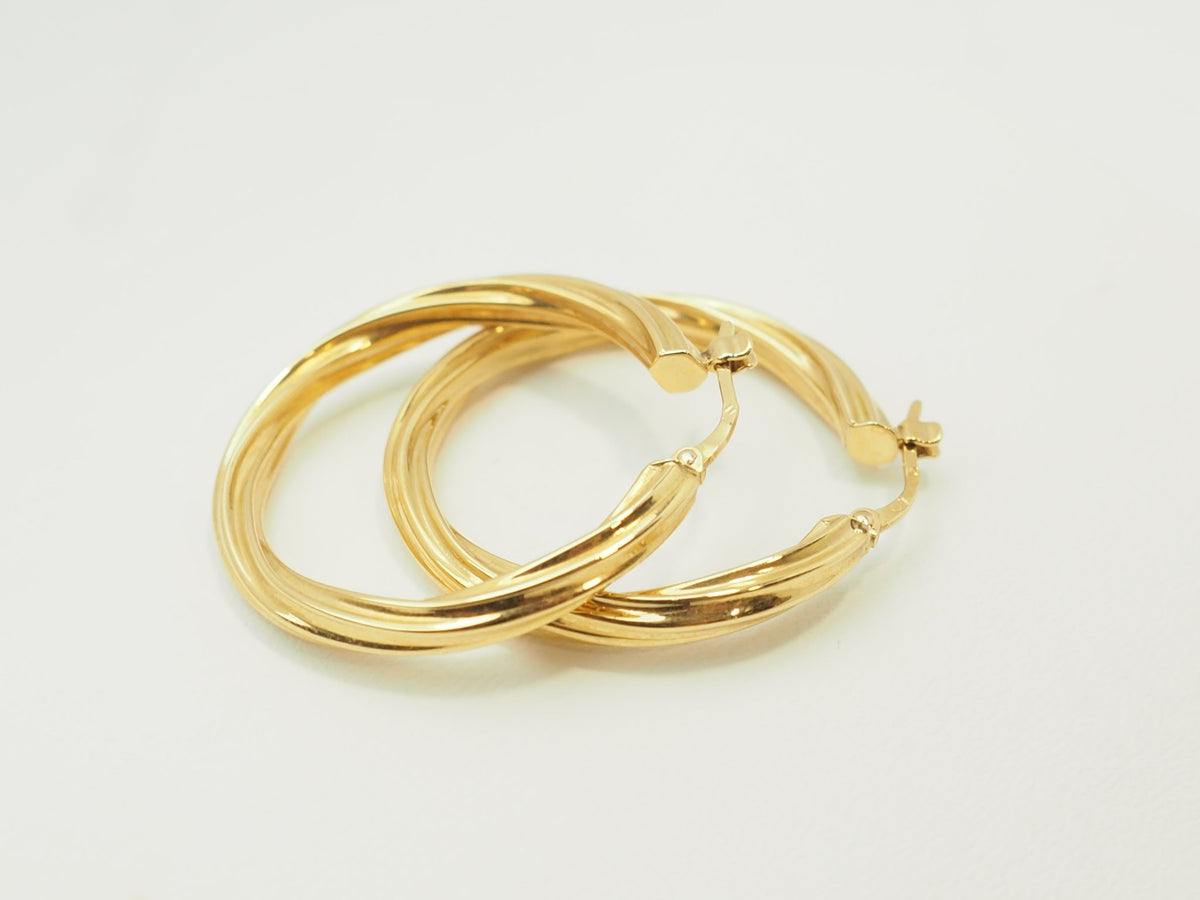 Créoles torsadées L'Aurore en or jaune 18 carats, diamètre 30 mm avec finition polie brillante