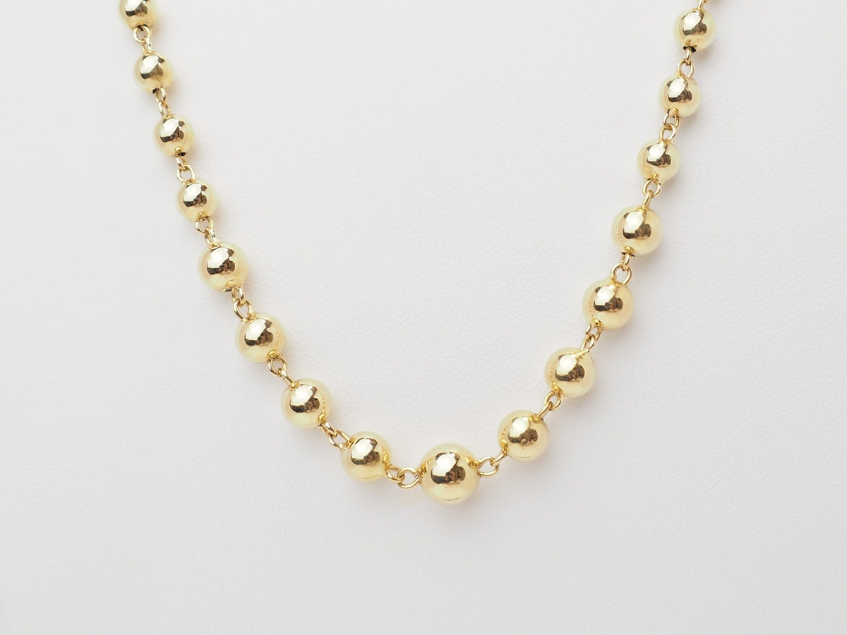 Collier marseillais vintage L'Aurore en or jaune 18 carats composé de boules polies de tailles dégressives