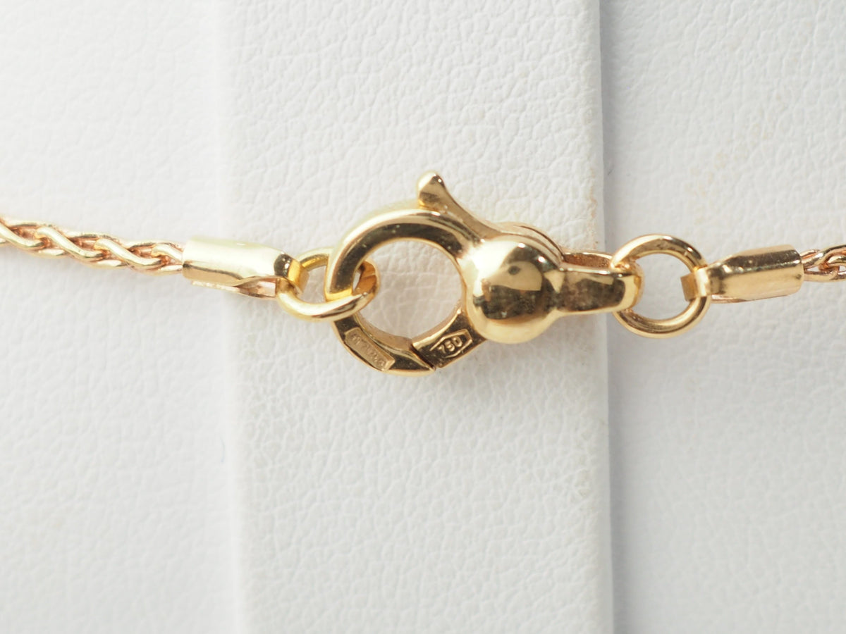 Collier pendentif fleur en or rose, pierres fines et diamants